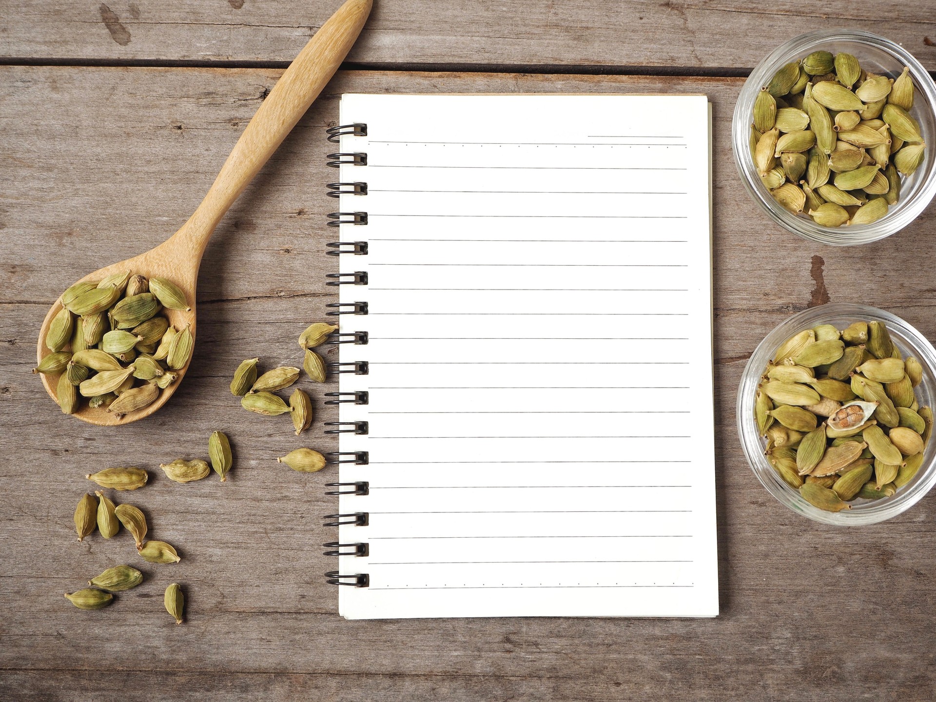 Cardamom with blank notepad