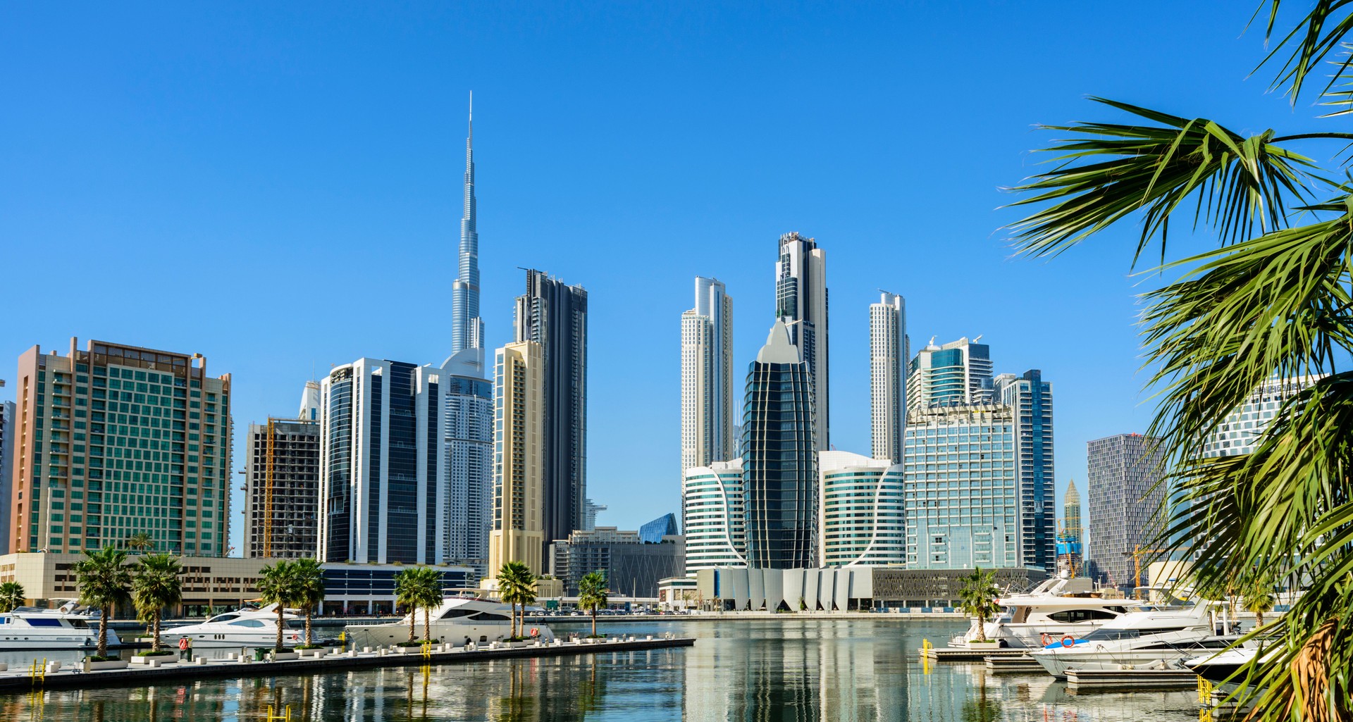 Boats Moored in the Marina and City Skyline in Dubai, United Arab Emirates